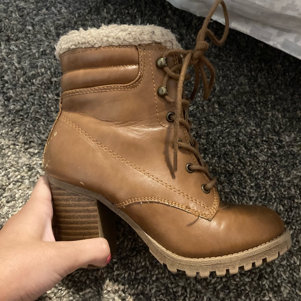 Brown heeled boots with fur at the top